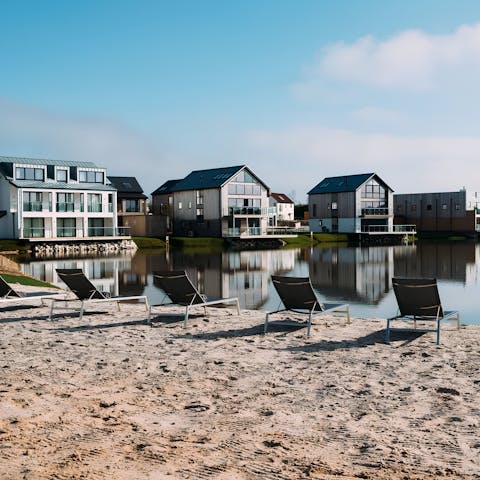 Relax on the sands of the complex's shared beach