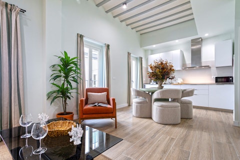 Gather in a light-filled room with exposed beam ceilings