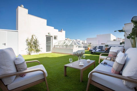 Head up to the shared rooftop terrace with a glass of wine