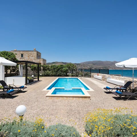 Spend your downtime outdoors, where this private pool is steps from Rapanias Beach