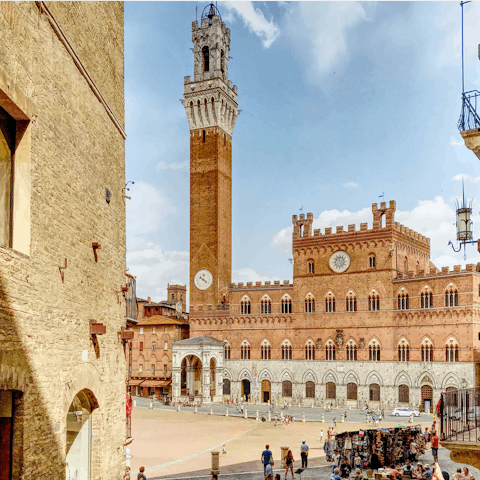 Visit the iconic central square, Piazza del Campo, in Siena