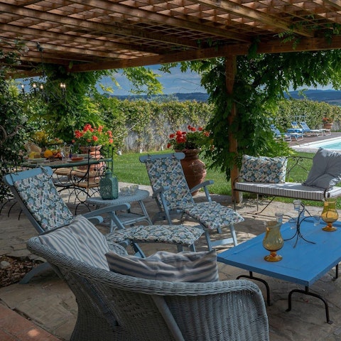 Relax on the shaded terrace with your holiday read