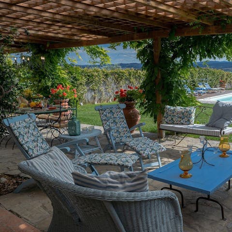 Relax on the shaded terrace with your holiday read