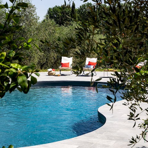 Spend the afternoon relaxing poolside in the hot Tuscan sun