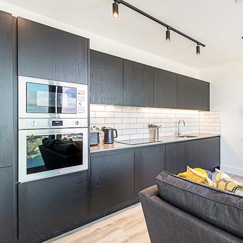 Cook up delicious meals in the sleek kitchen, fully equipped with high-end appliances