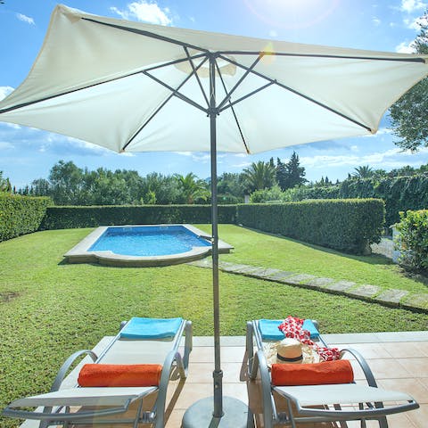 Sunbathe beneath blue skies after a romantic outing to the nearby Port de Pollença
