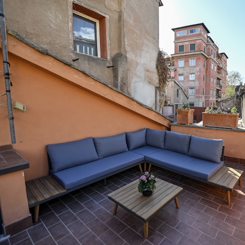 Lounge on the roof terrace with a glass of local wine