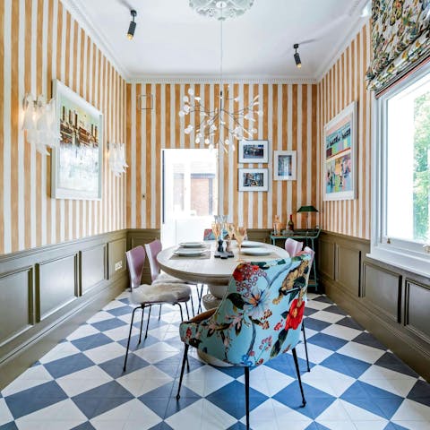 Gather in the colourful dining room for dinner and drinks