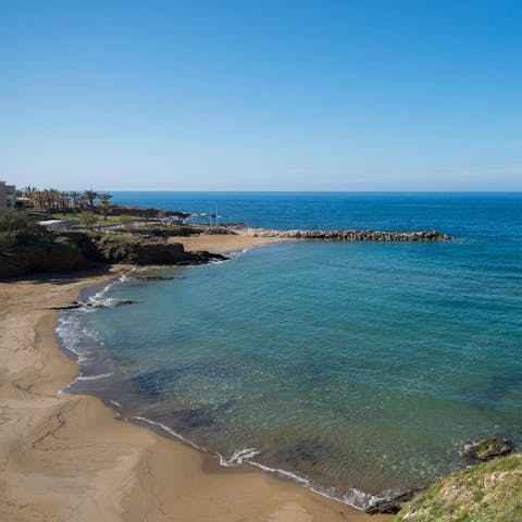 Sink your toes in the sand at the nearest beach, 300 metres away