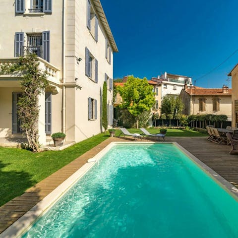 Enjoy a glass of Champagne next to the heated pool