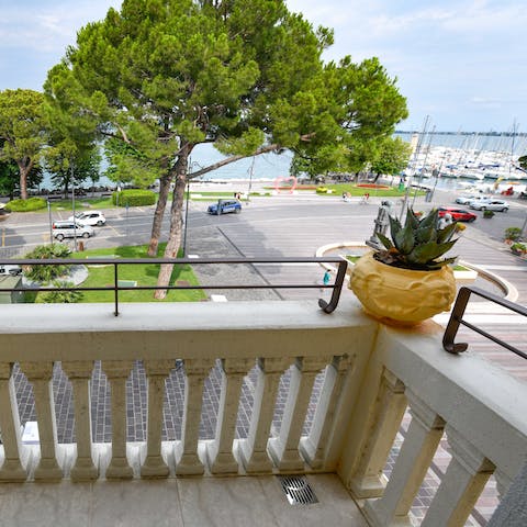 Enjoy the beautiful lakeside view from the balcony in the living space