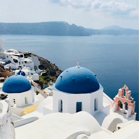 Explore the winding clifftop streets of Oia