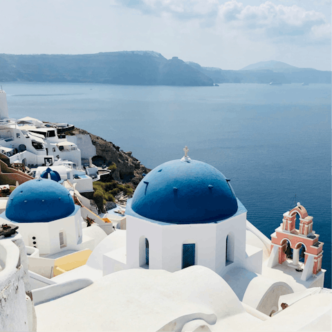 Explore the winding clifftop streets of Oia