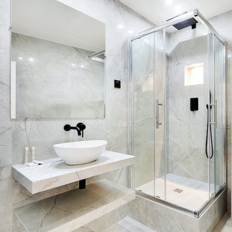 Start mornings with a luxurious soak under the bathroom's rainfall shower