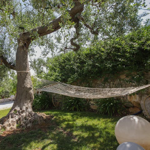 Lounge on the hammock with a book under the stars