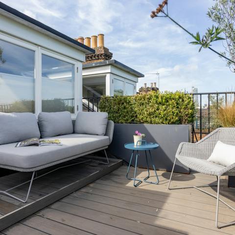 Enjoy a glass of Champagne on the private roof terrace