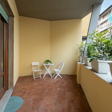 Relax on the private balcony with a glass of Prosecco