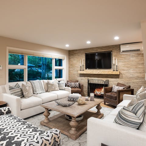 Cosy up by the fire in the elegant living room