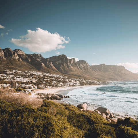 Wander the beach and sip cocktails in trendy bars in Camps Bay