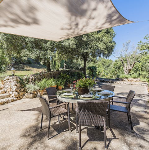 Dine outdoors in the shade of the sail canopy