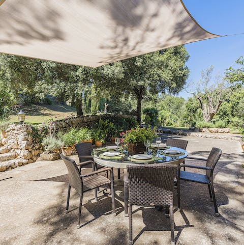 Dine outdoors in the shade of the sail canopy