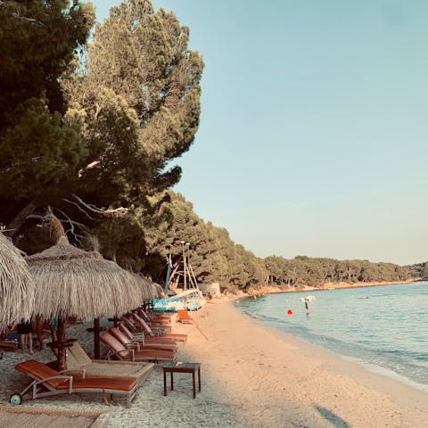 Hire a lounger and spend a day at the crescent-shaped Cala Formentor, approximately 20km away