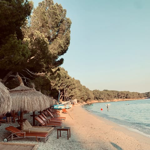 Hire a lounger and spend a day at the crescent-shaped Cala Formentor, approximately 20km away