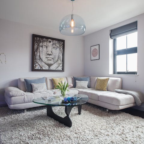 Stay in and snuggle up with Netflix on the Italian suede sofa