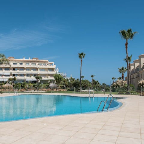 Swim in the communal pool to beat the Spanish heat