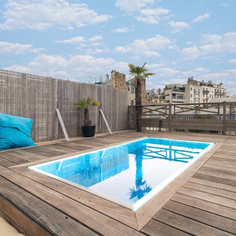 Admire the Paris skyline from the warmth of the rooftop hot tub