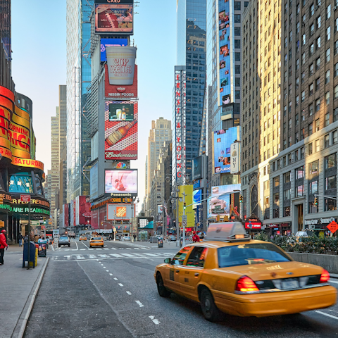 Hop in a famous yellow taxi and whizz over to Times Square