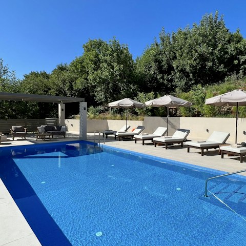 Slip into the inviting blue pool for a refreshing dip