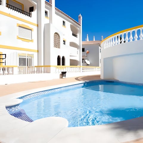 Swim in the communal pool to cool off in the Portuguese heat