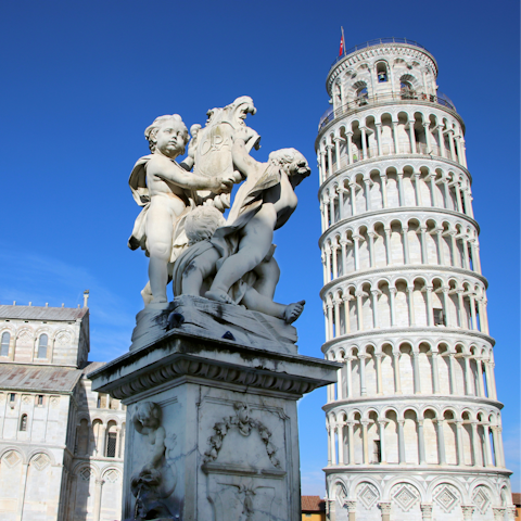Plan a day trip to Pisa, which is thirty minutes away by car