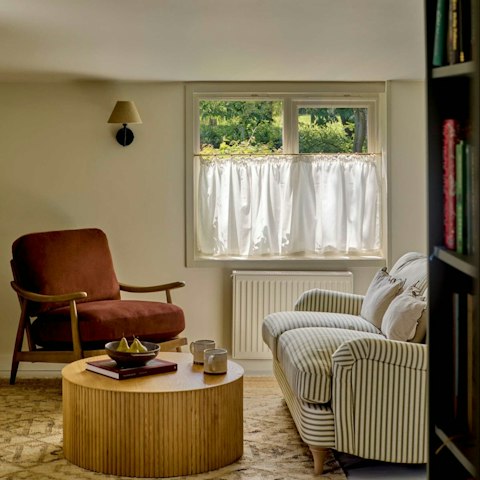 Curl up in the living area with a book from the host's small library