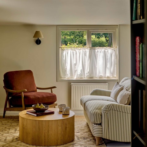 Curl up in the living area with a book from the host's small library