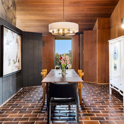 Enjoy home-cooked meals in the sleek, mid-century dining room