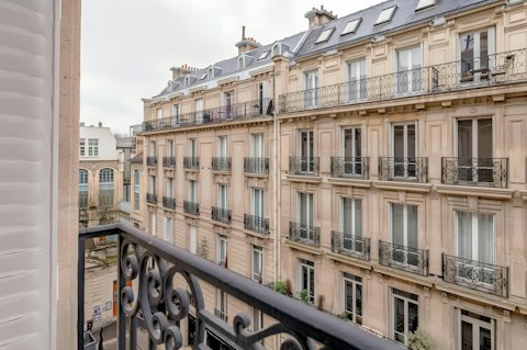 Admire the Hausmann architecture from the Juliet balcony
