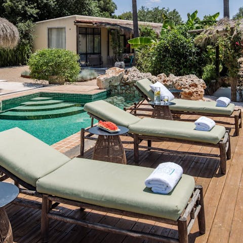Soak up the sunshine, lounging by the pool