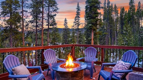 Gather around the fire pit as alpenglow fades behind the pines