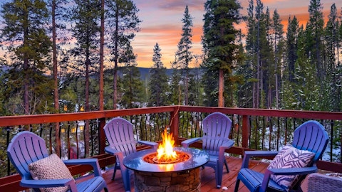 Gather around the fire pit as alpenglow fades behind the pines