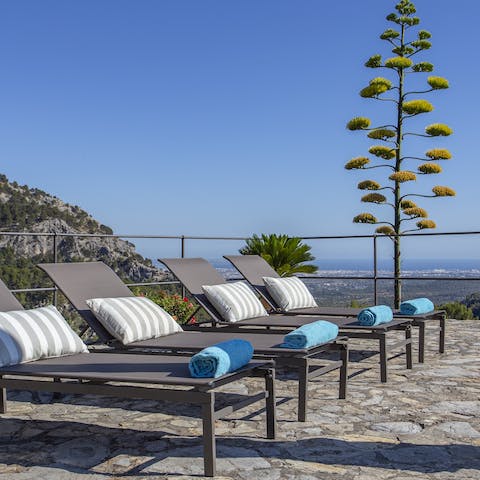Relax and unwind on one of the comfortable sun loungers