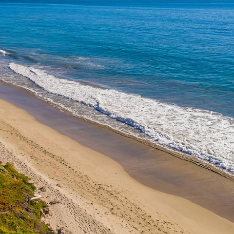 Walk down onto Lechuza Beach from your garden