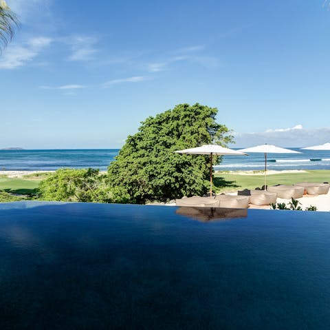 Float under never-ending blue skies in the heated infinity pool