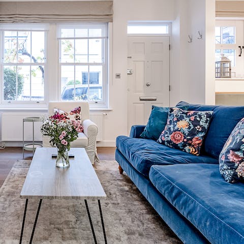 Curl up on the comfy velvet sofa with a good book