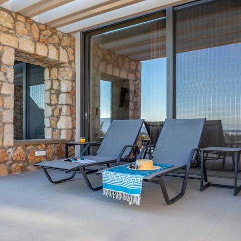 Admire beautiful sunsets over a glass of Champagne