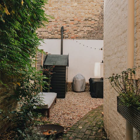 Bask in the early summer evening warmth in the home's back garden