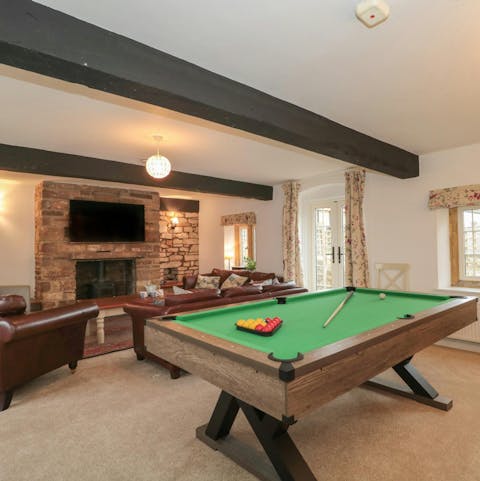 Get competitive playing pool or curl up in front of the fire