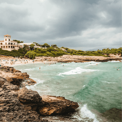 Drive up to Alcudia beach for soft golden sands and crystal clear waves