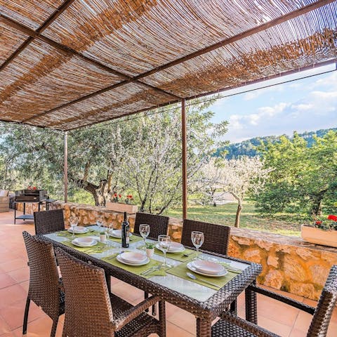 Gather for an alfresco meal of paella and pincho ribs